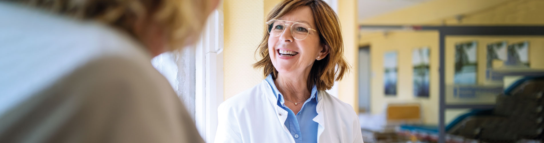 Female doctor talking to female patient, Clinical genomics, blood cancer, oncology